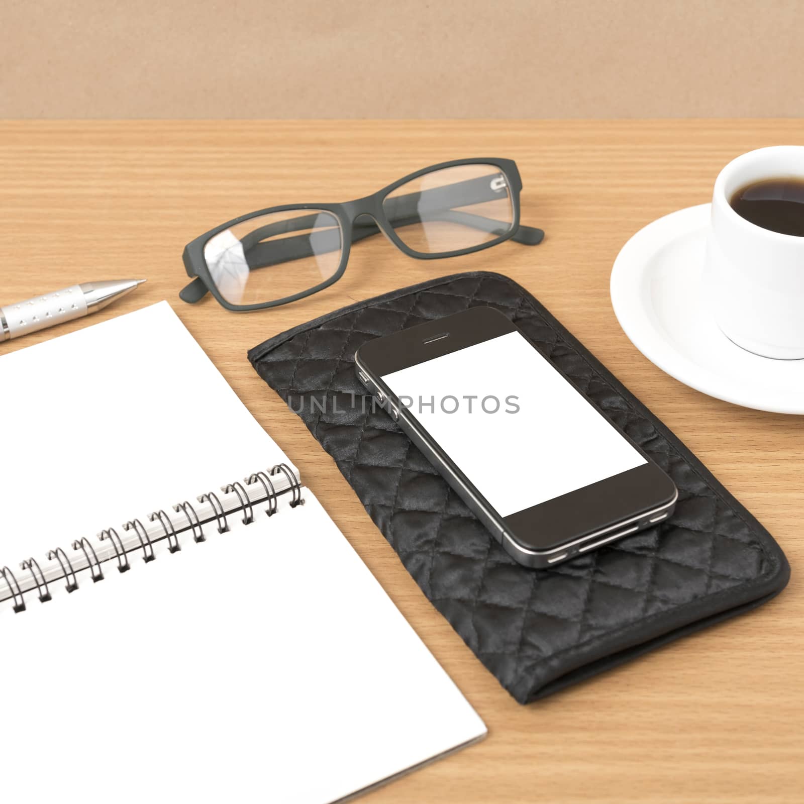 coffee,phone,eyeglasses,notepad and wallet on wood table background