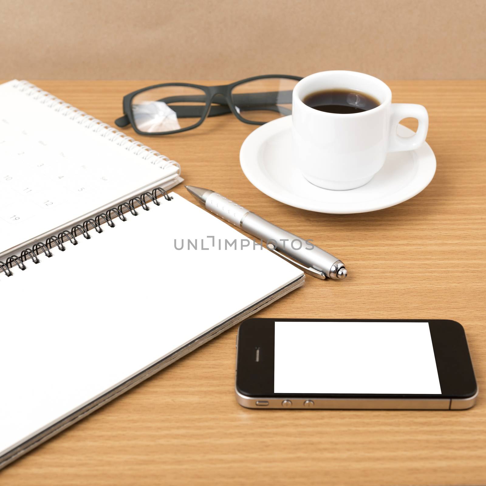 coffee,phone,eyeglasses,notepad and canlendar on wood table background