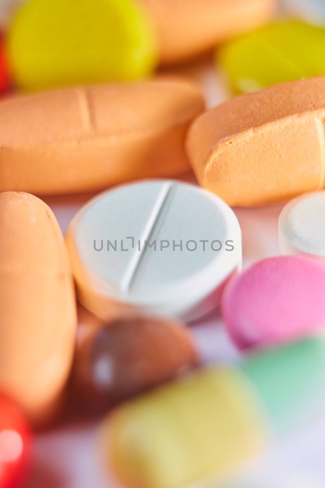 Close up of many colorful pills. Top view with copy space. Medicine concept. Shallow dof