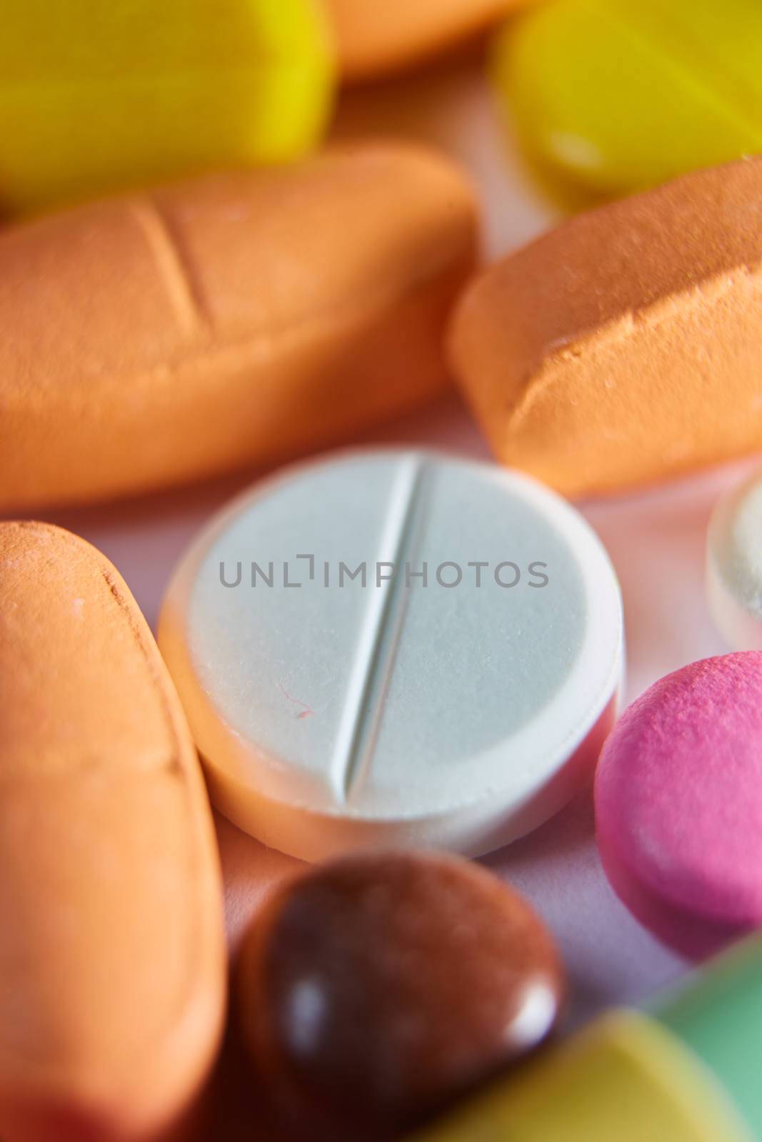 Close up of many colorful pills. Top view with copy space. Medicine concept. Shallow dof