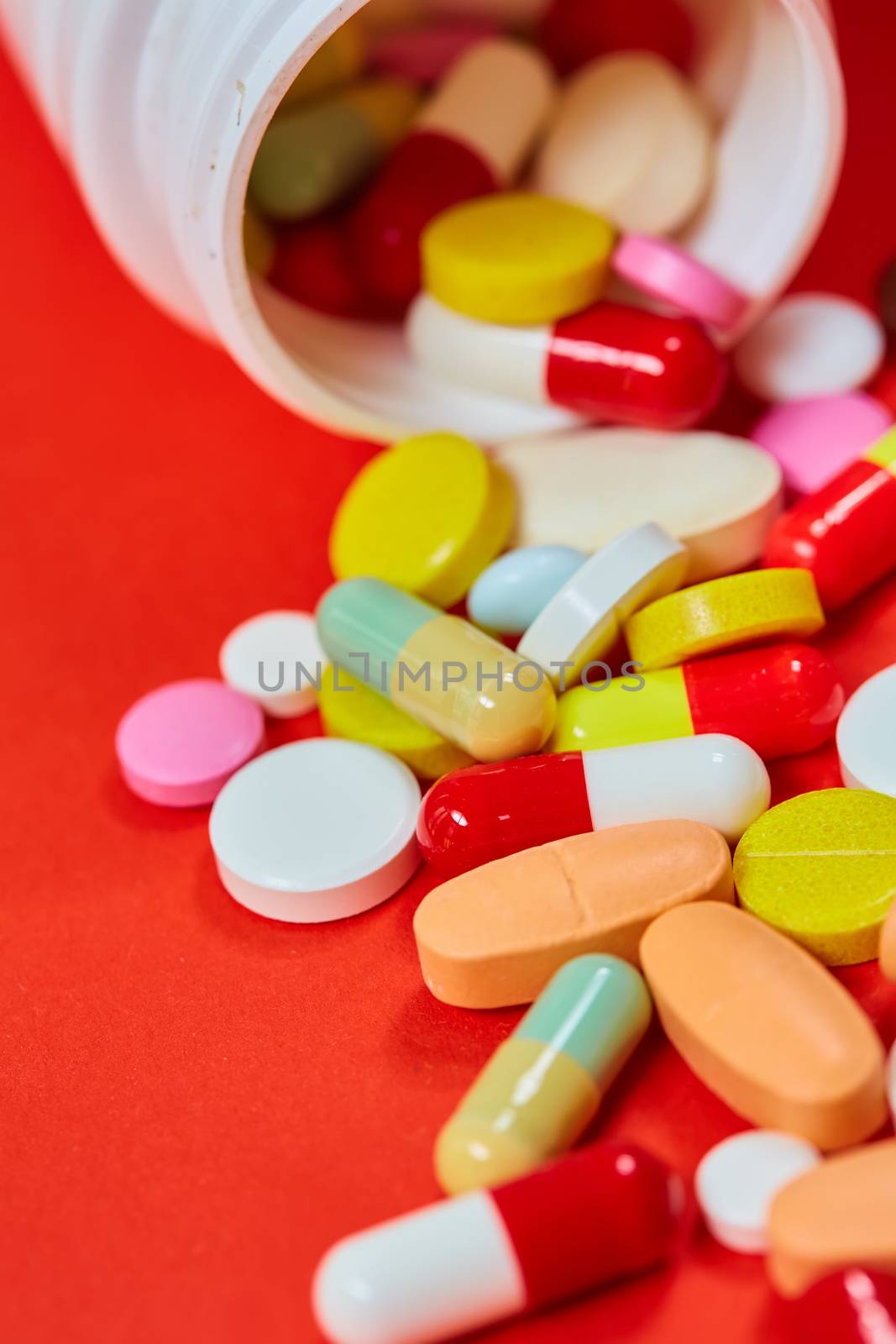 Close up of many colorful pills. Top view with copy space. Medicine concept. Shallow dof