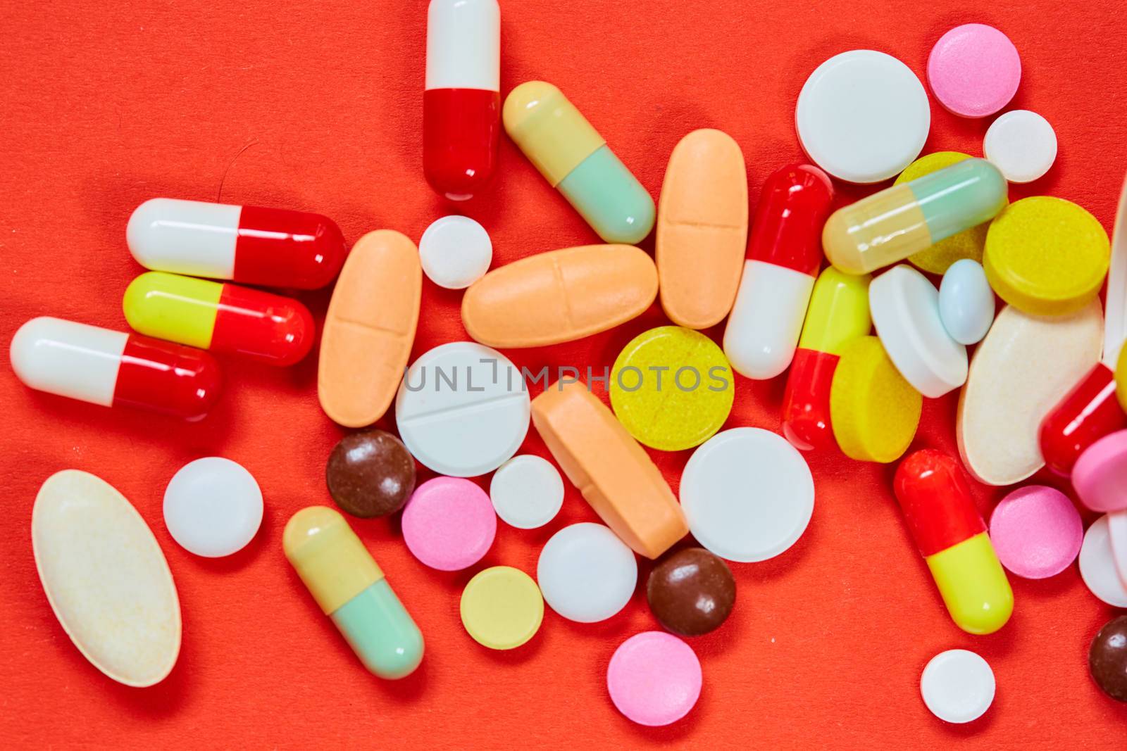 Close up of many colorful pills. Top view with copy space. Medicine concept. Shallow dof