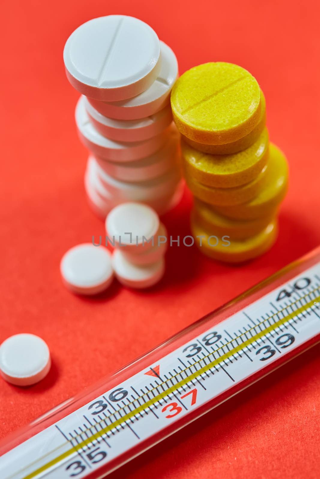 Mercury thermometer and medical pills. Top view with copy space. Medicine concept