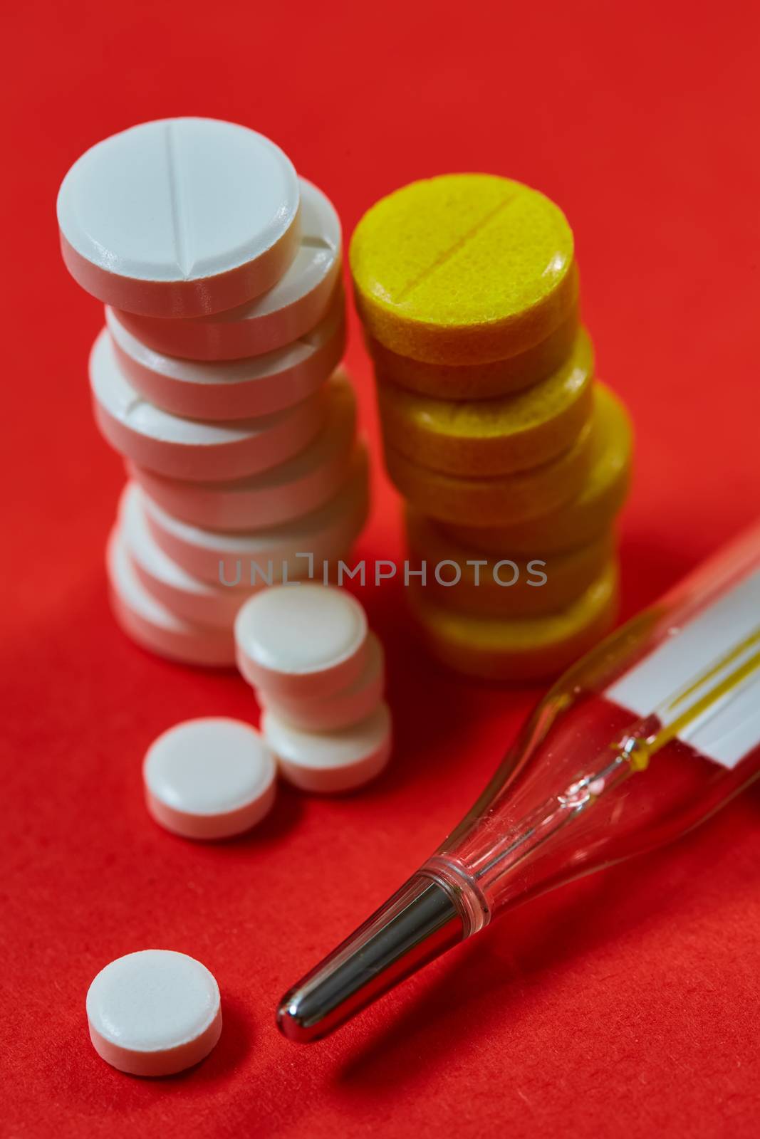 Mercury thermometer and medical pills. Top view with copy space. Medicine concept