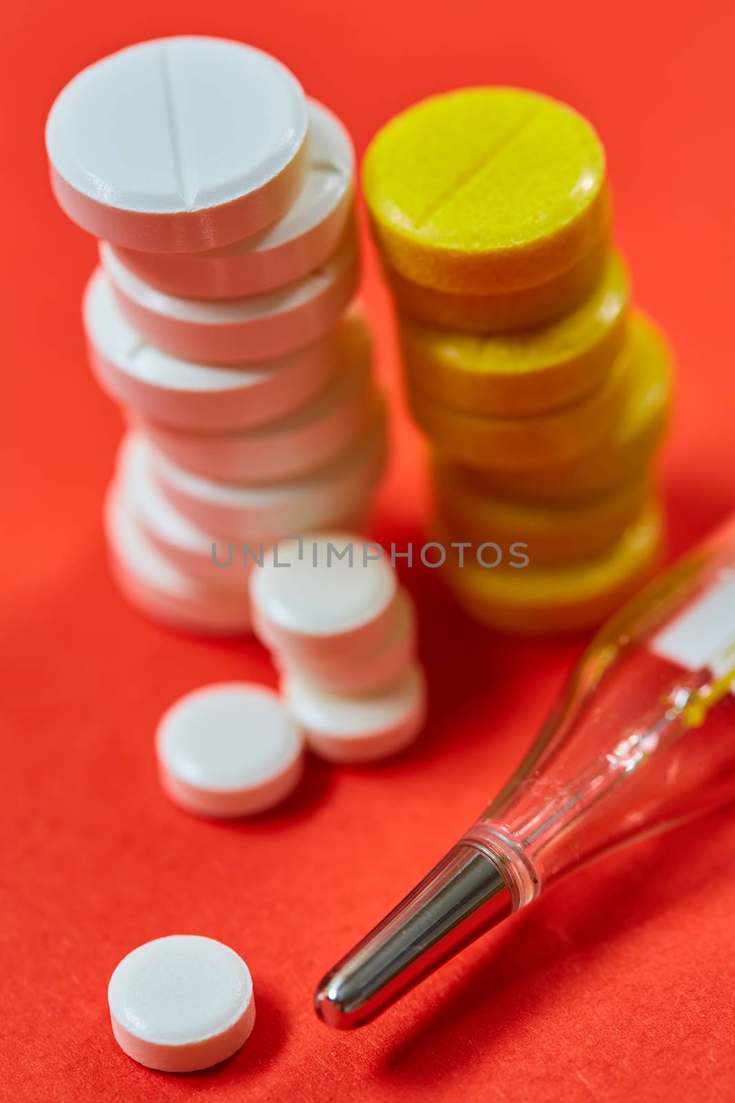 Mercury thermometer and medical pills. Top view with copy space. Medicine concept