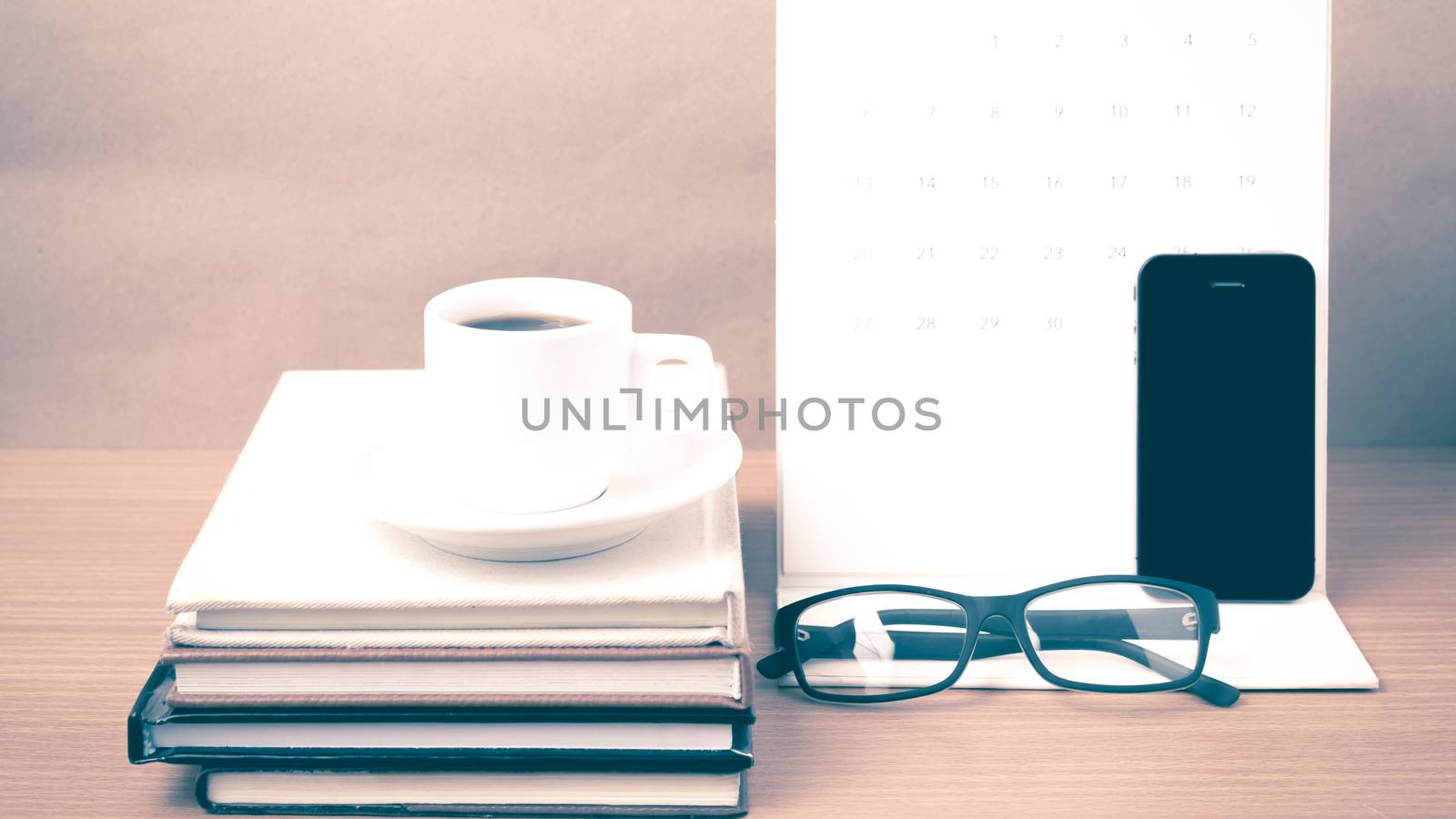 coffee,phone,eyeglasses,stack of book and calendar by ammza12