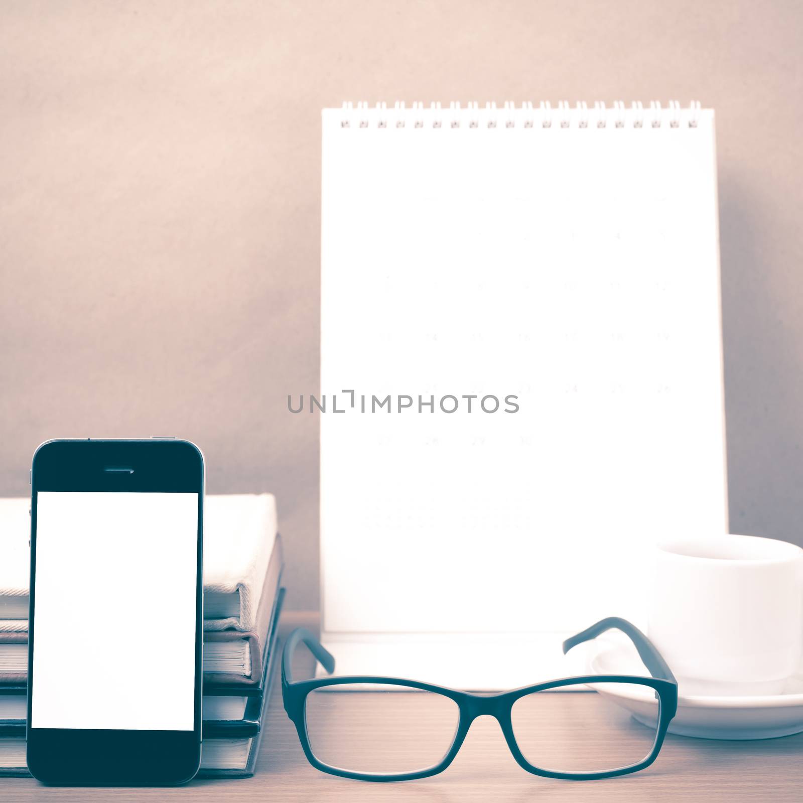 coffee,phone,eyeglasses,stack of book and calendar by ammza12