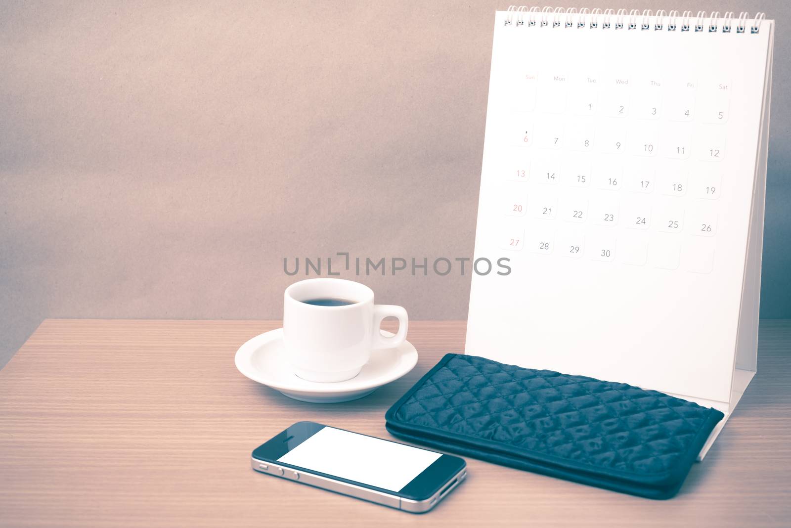 coffee,phone,wallet and canlendar on wood table background vintage style
