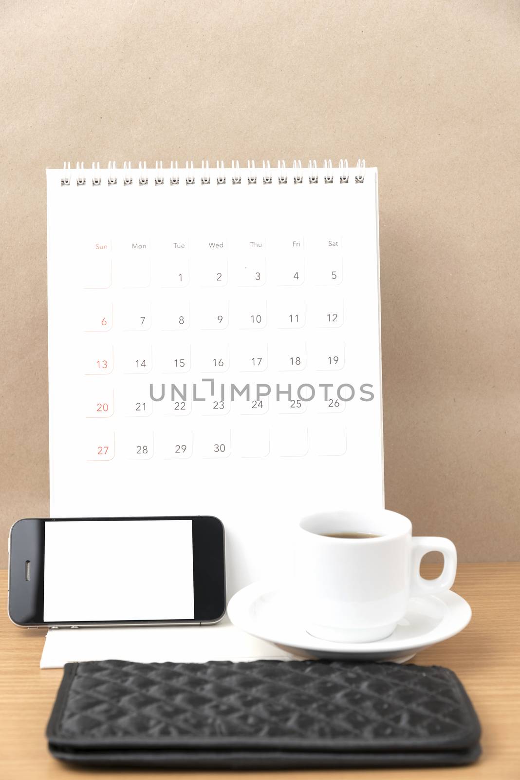 coffee,phone,wallet and canlendar on wood table background