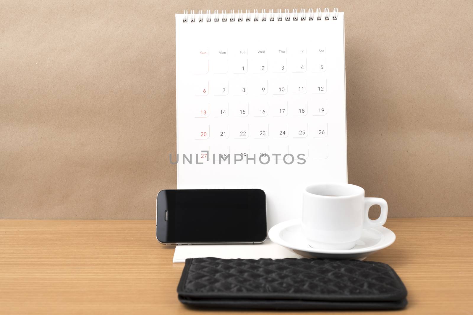 coffee,phone,wallet and canlendar on wood table background