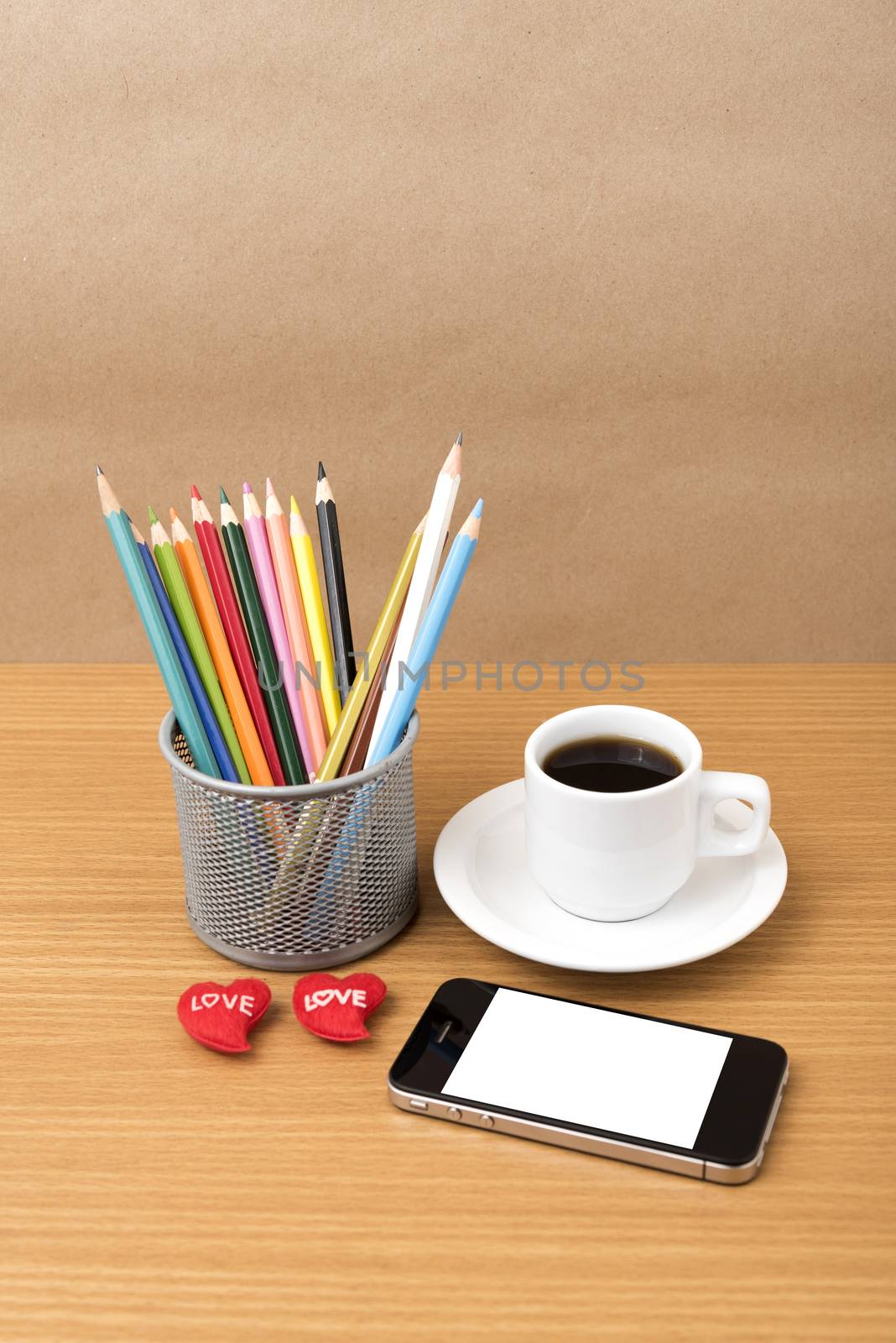 coffee,phone,color pencil and heart on wood table background