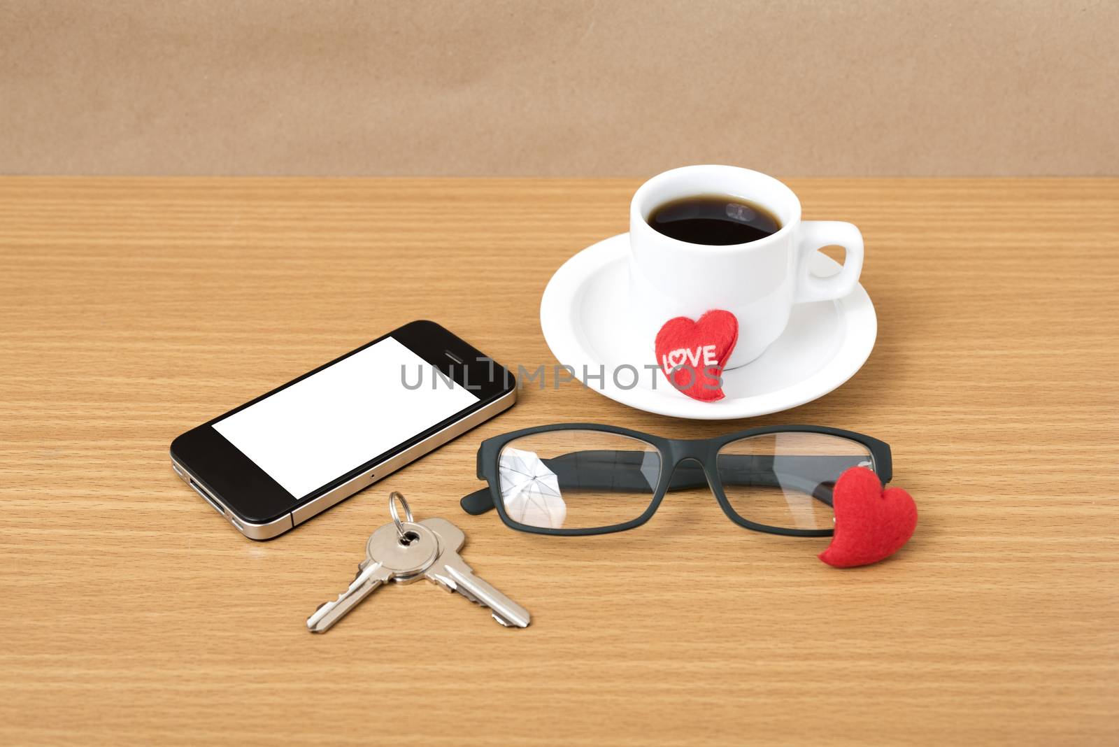 coffee,phone,eyeglasses and key on wood table background