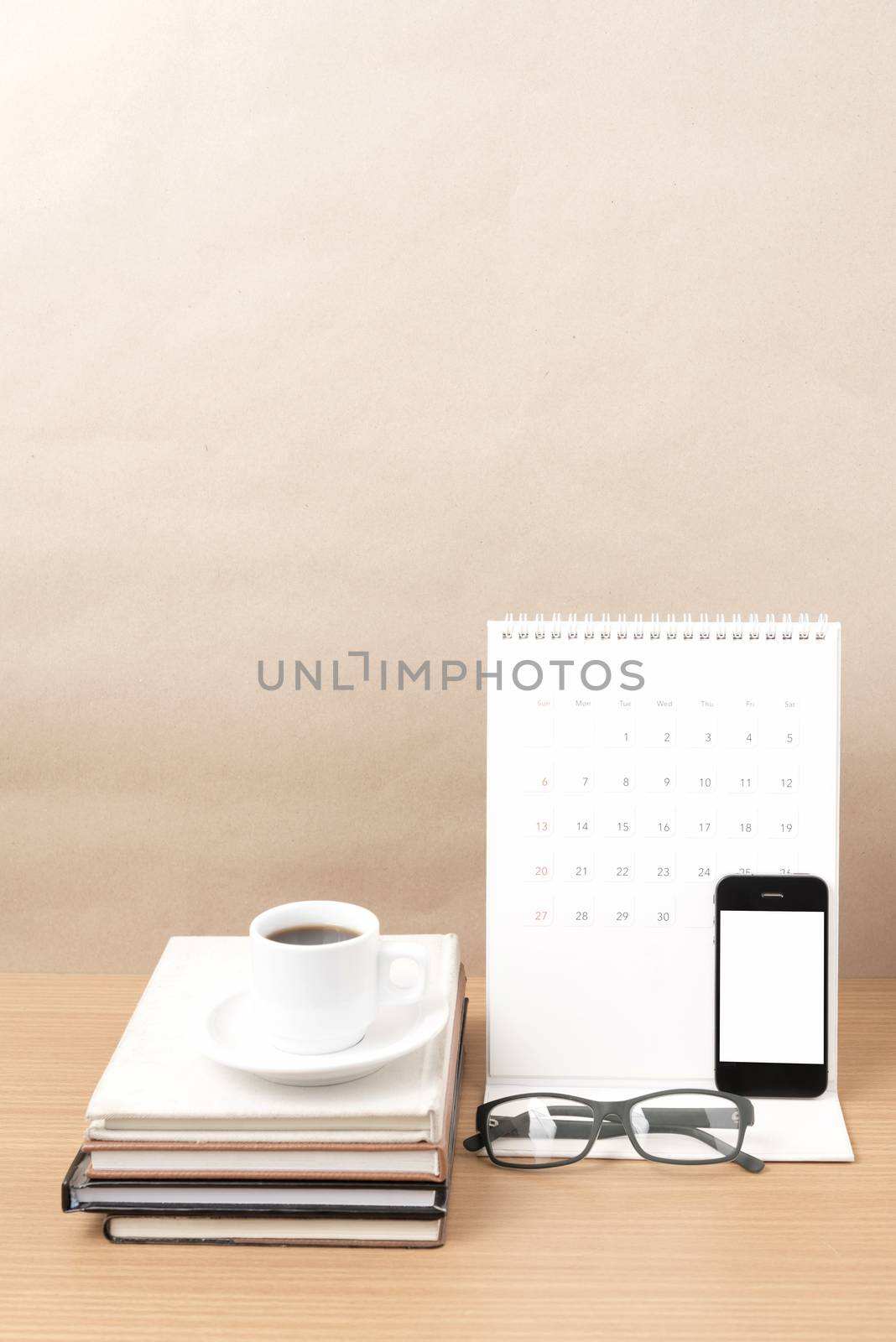 coffee,phone,eyeglasses,stack of book and calendar by ammza12