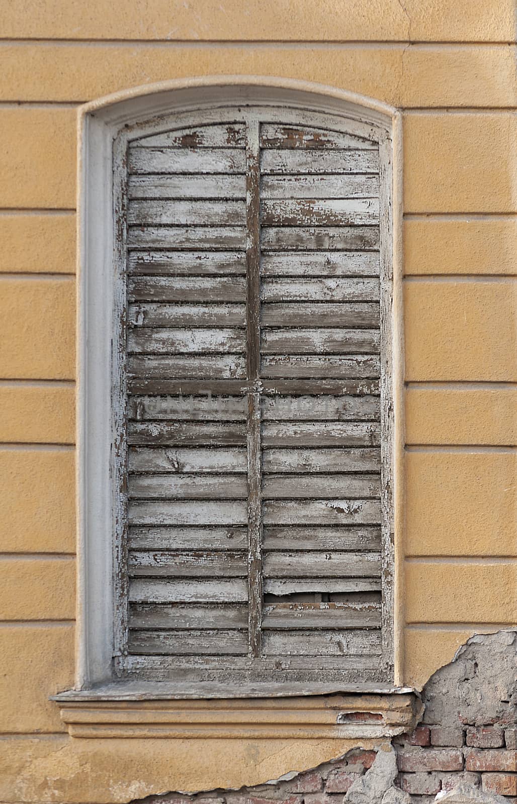 Old weathered wall and window. Window frame.