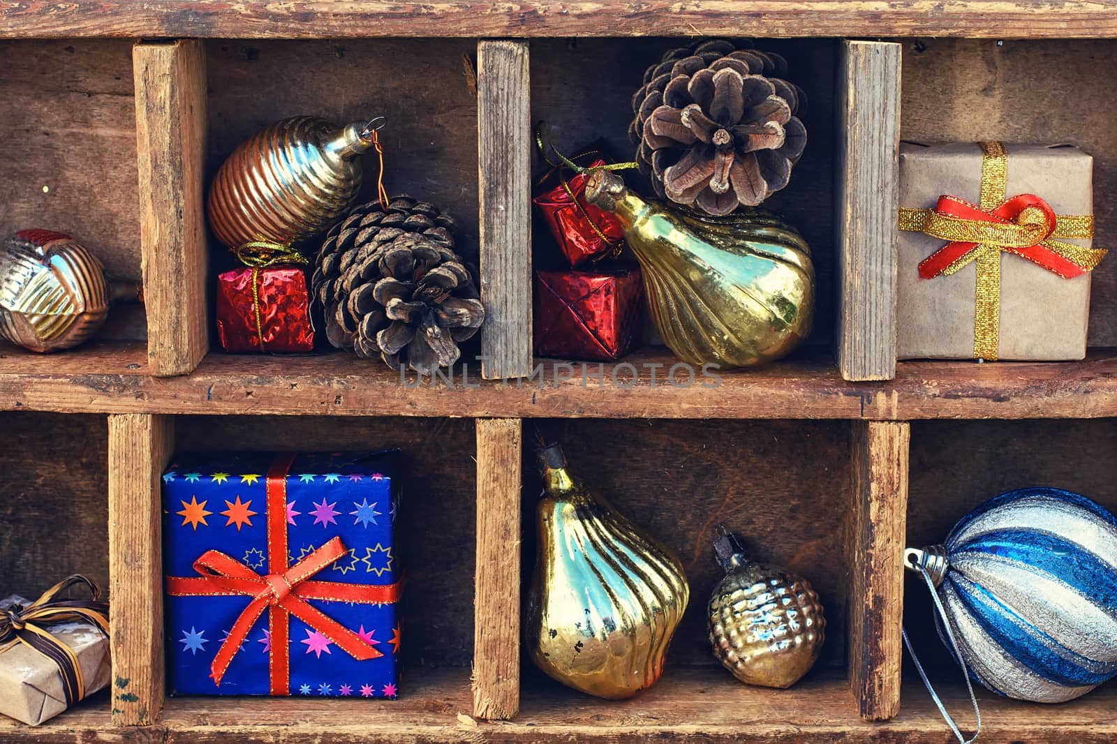 Vintage wooden box with compartments in which Christmas toys and gifts