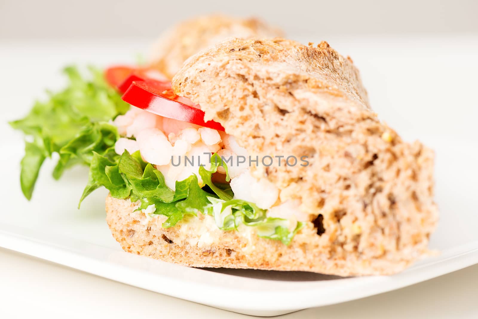 Prawn sandwich on white plate selective focus by Nanisimova