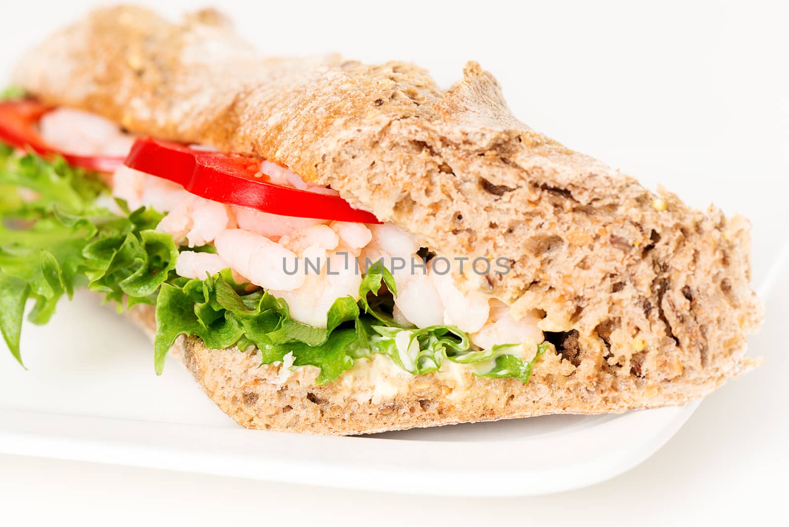 Prawn sandwich on white plate macro by Nanisimova