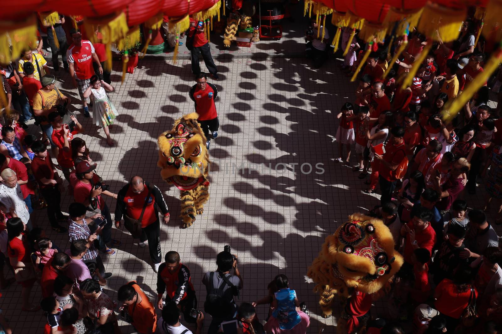 MALAYSIA, Kuala Lumpur: People gather around to watch the Lion dance, a traditional Chinese dance, at Thean Hou Temple on the first day of the Lunar New Year in Kuala Lumpur's popular Chinatown area on February 8, 2016. Some 25 percent of Malaysia's 29 million people are ethnic Chinese and celebrate the Lunar New Year, this year marking the Year of the Monkey.