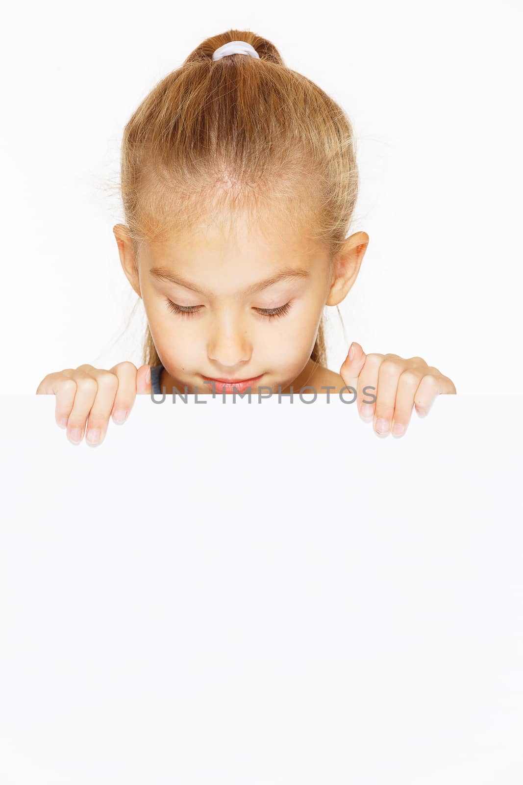 Little girl with blank sign isolated on white