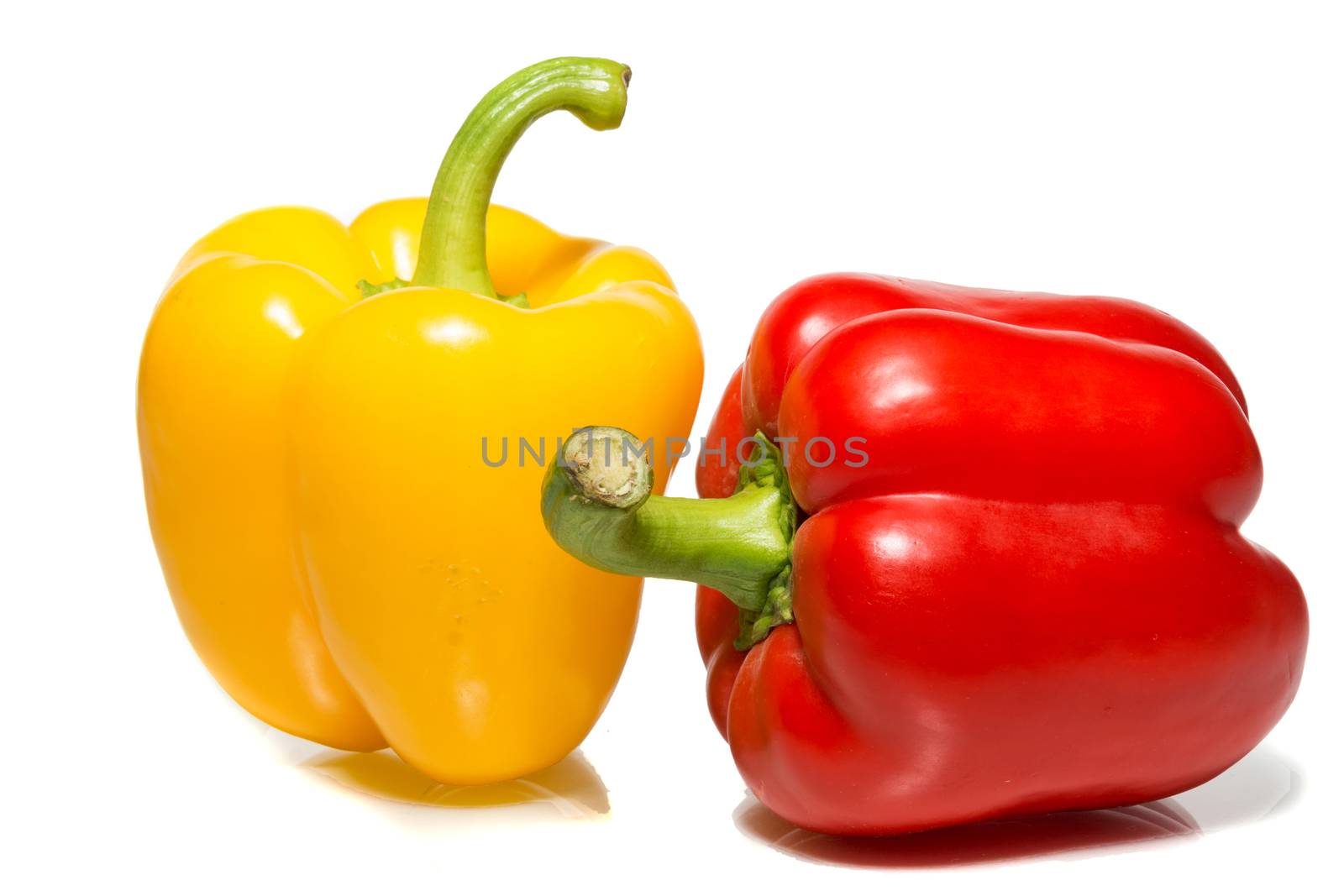 The photograph depicts peppers on a white background