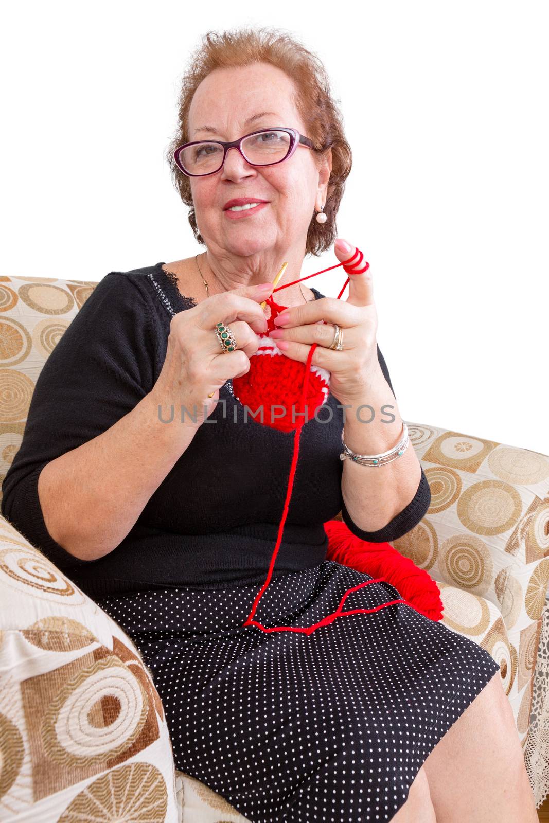 Senior lady relaxing with her knitting by coskun