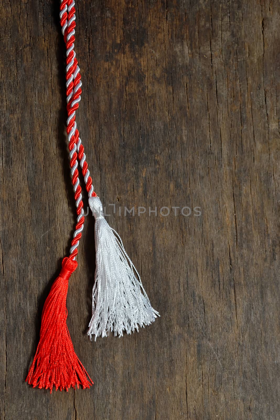 March 1 traditional trinket simbol on wooden background