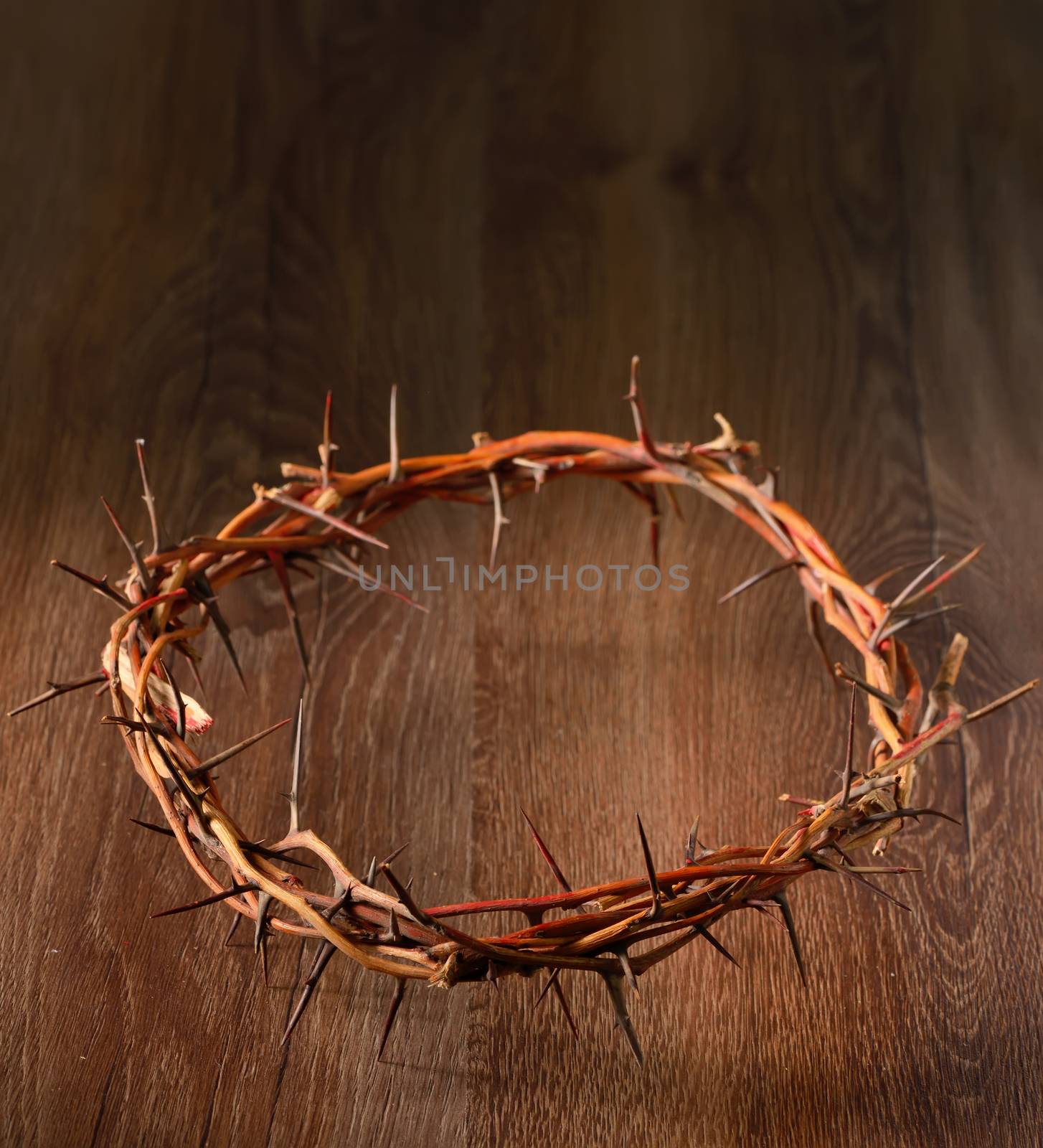 Crown of thorns on wooden background