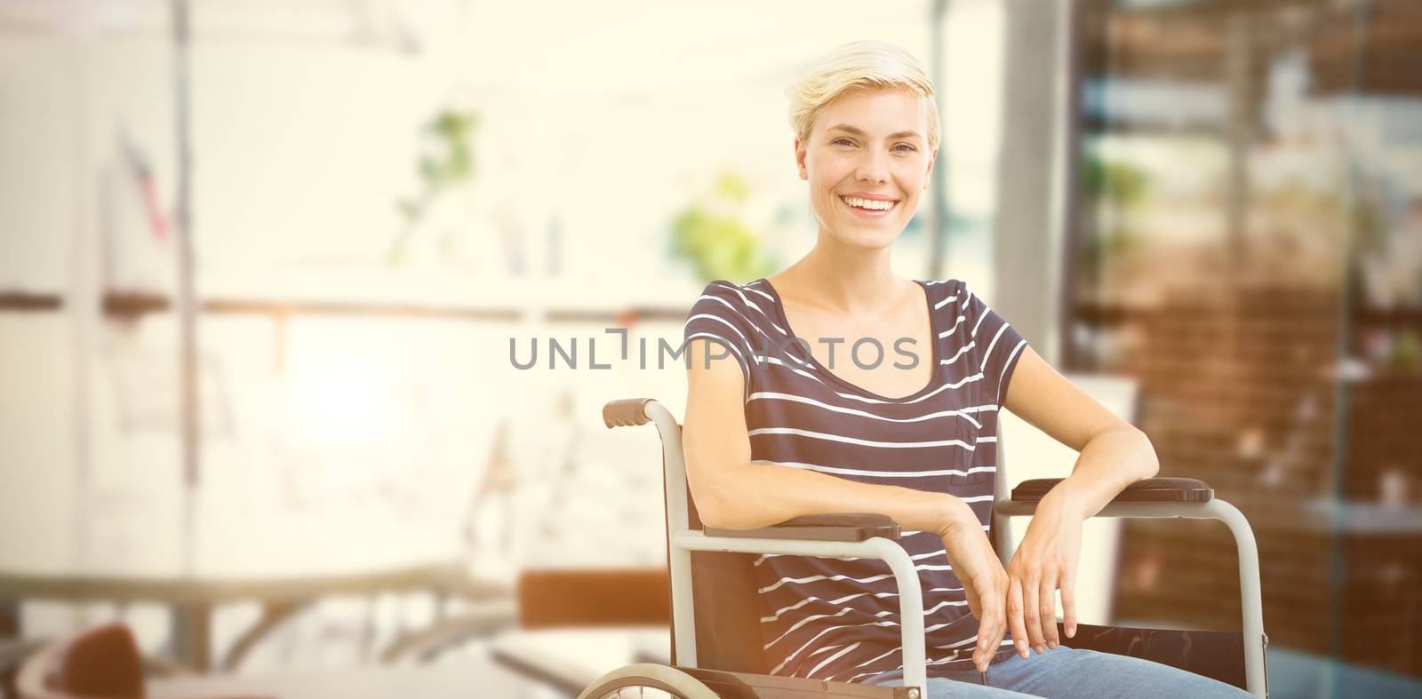 Composite image of smiling woman in a wheelchair by Wavebreakmedia