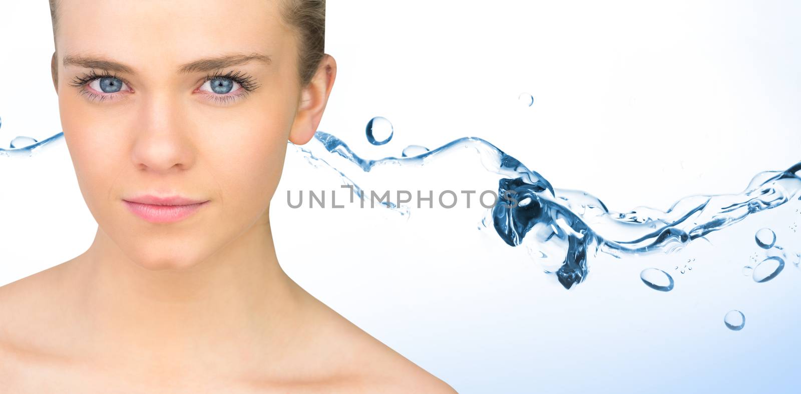 Serious blonde natural beauty against water bubbling on white surface