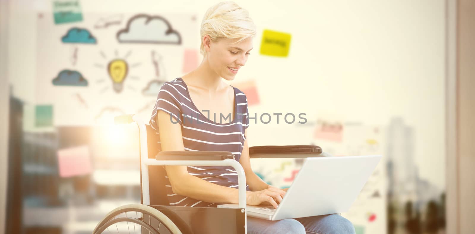 Woman in wheelchair using computer against adhesive notes on window 