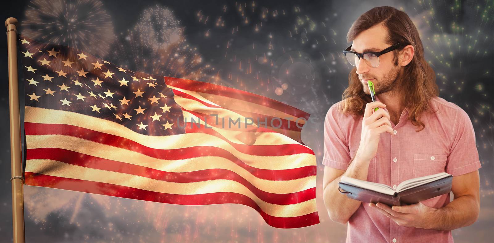 Composite image of thoughtful hipster holding pen and book by Wavebreakmedia