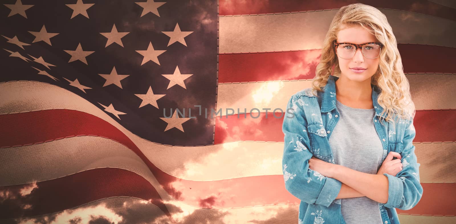 Composite image of portrait of businesswoman wearing eyeglasses with arms crossed  by Wavebreakmedia