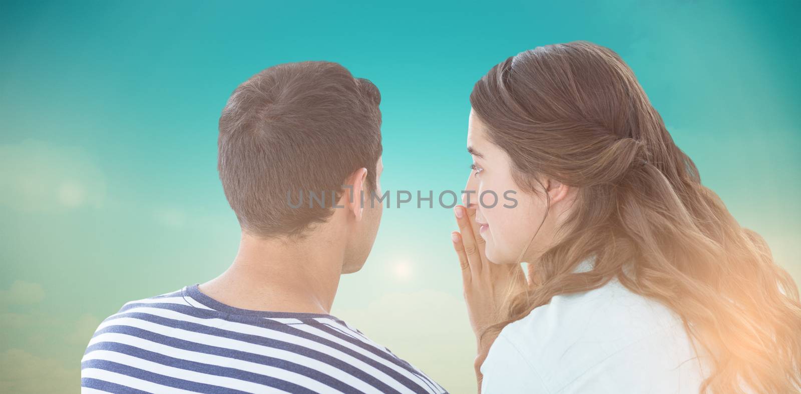 Composite image of woman whispering secret to boyfriend by Wavebreakmedia