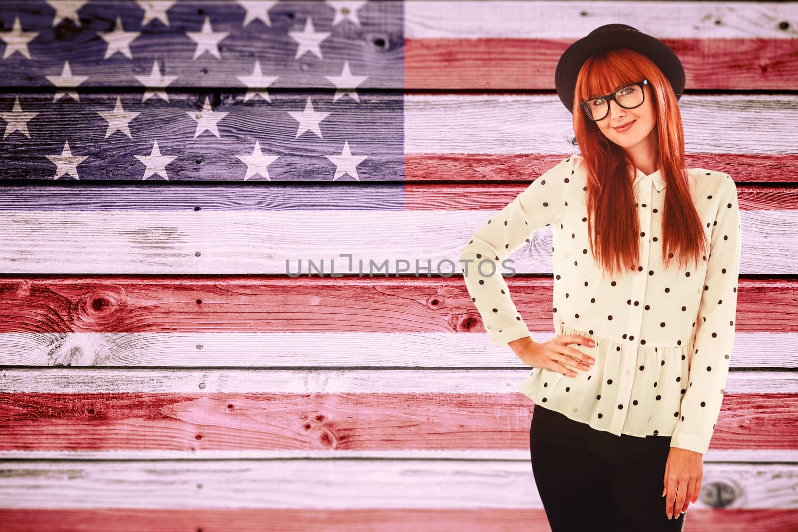 Portrait of a smiling hipster woman against composite image of usa national flag