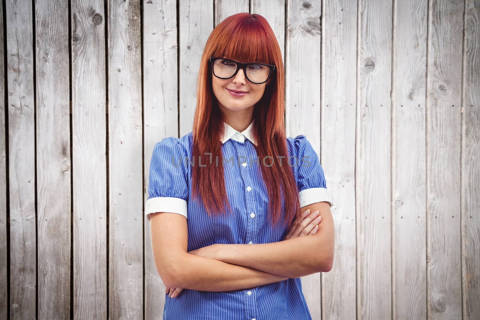 Composite image of attractive hipster woman with crossed arms by Wavebreakmedia