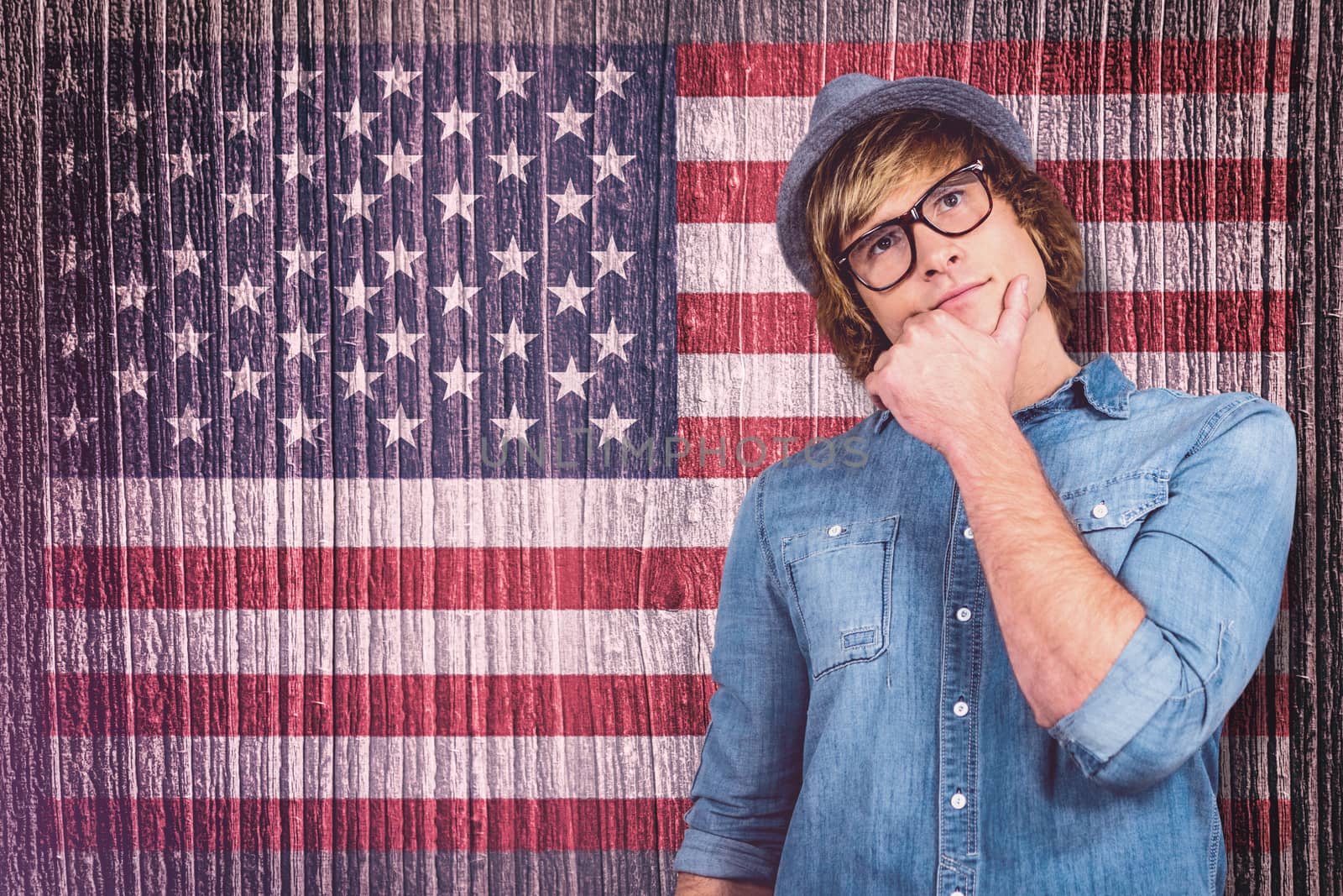 Close up of hipster man thinking against composite image of usa national flag