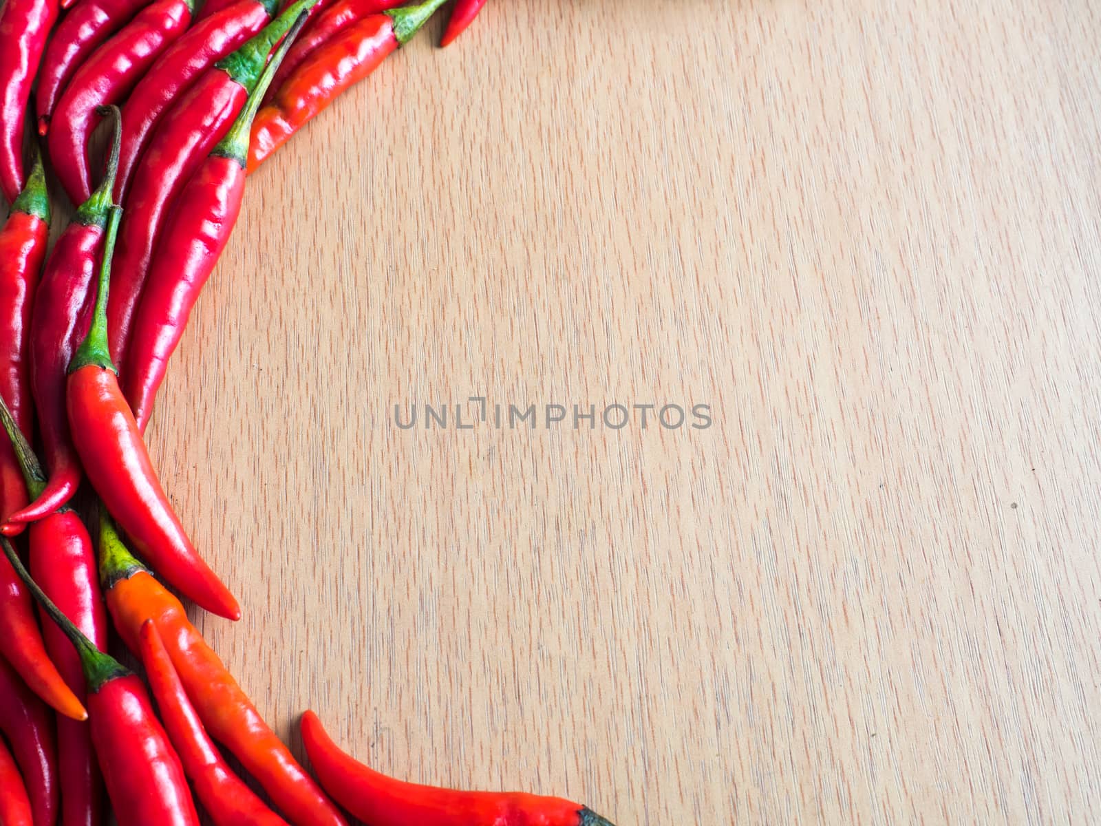 red hot chili on wood plate