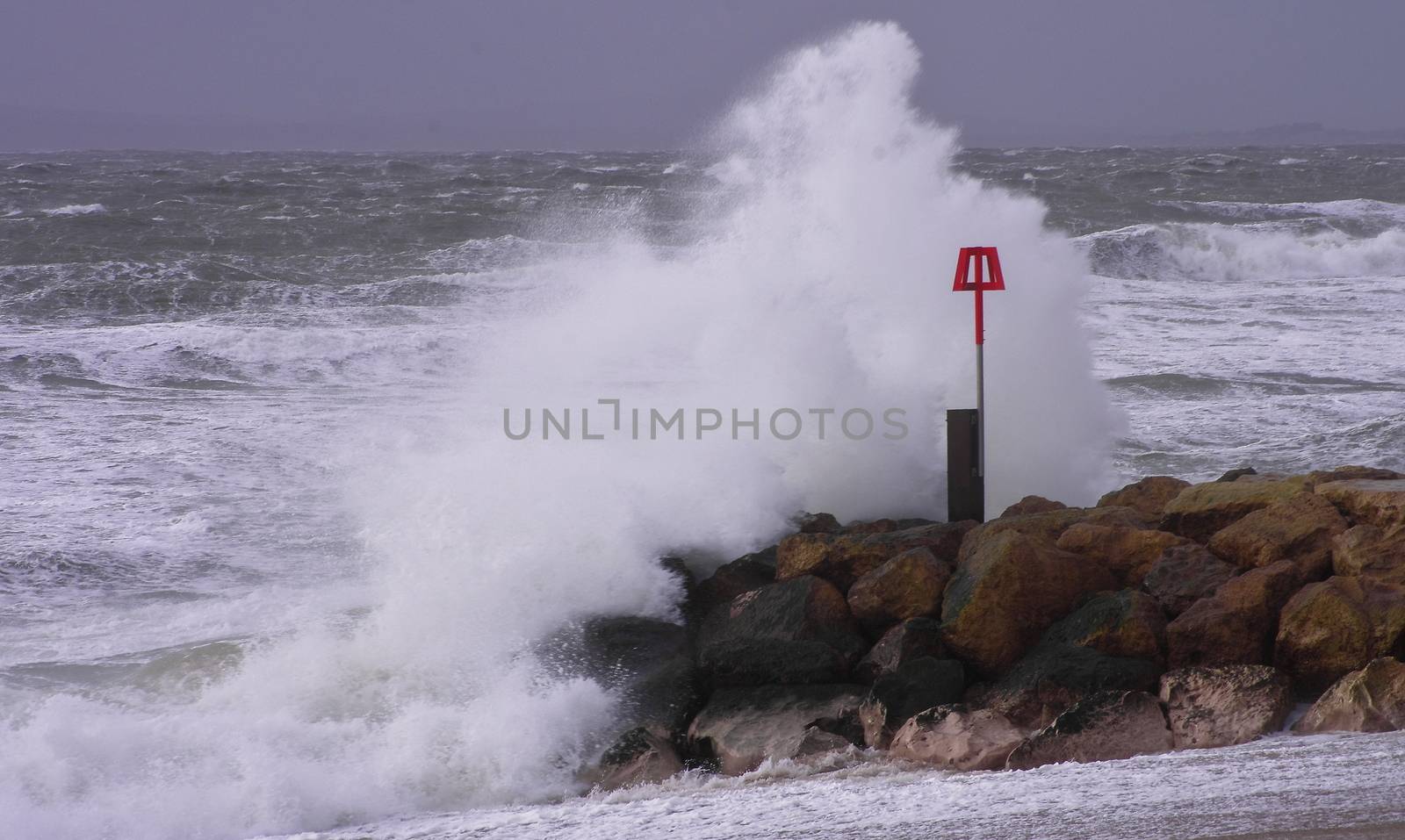 UK, Dorset: Waves crash on the south coast near Dorset as Storm Imogen batters the UK with winds reaching up to 80mph on February 8, 2016. With the UK on amber alert, gale-force winds and heavy rainfall have caused disruption to local train and ferry services. A 64-year-old inspector from the Royal Society for the Prevention of Cruelty to Animals reportedly went missing Sunday.