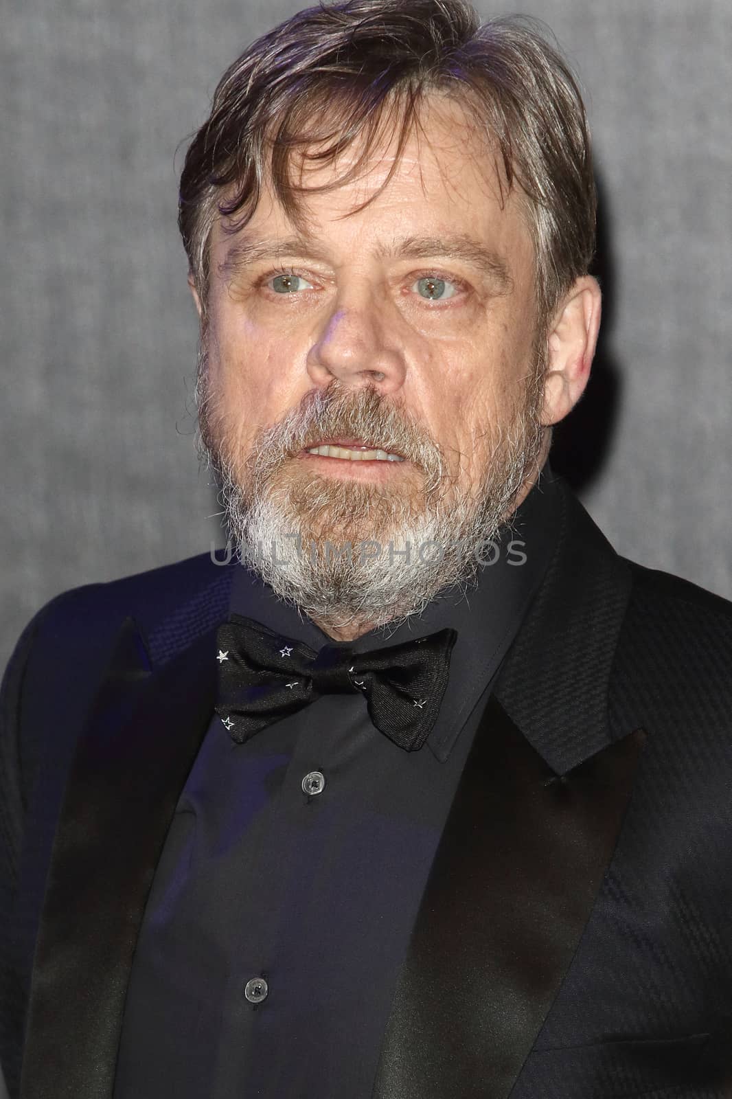 UNITED-KINGDOM, London : American Actor Mark Hamill, who plays Luke Skywalker, poses for photographers while Star Wars cast, crew and celebrities hit the red carpet for the last episode The Force Awakens European Premiere on December 16, 2015 in central London.   	