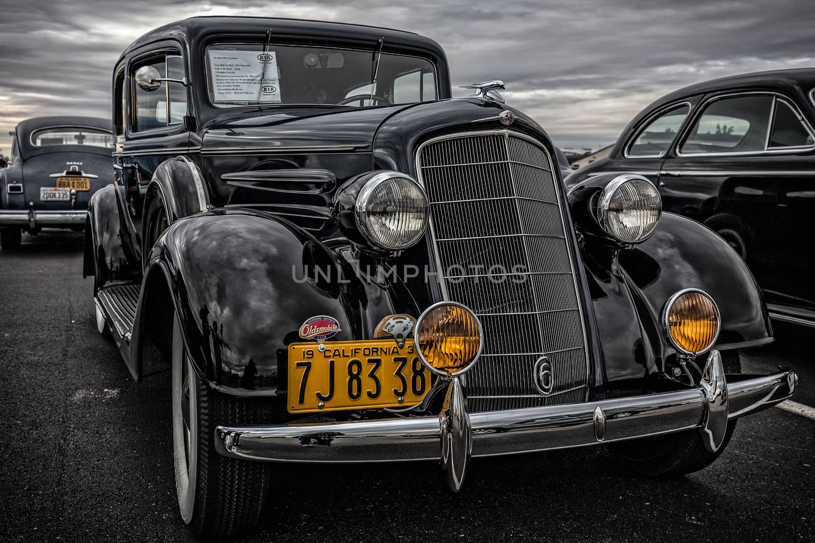Redding, California, USA-September 28, 2014: A restored 1934 black Oldsmobile classic on display at a car show in Redding showing off it's chrome front end and highly polished paint.