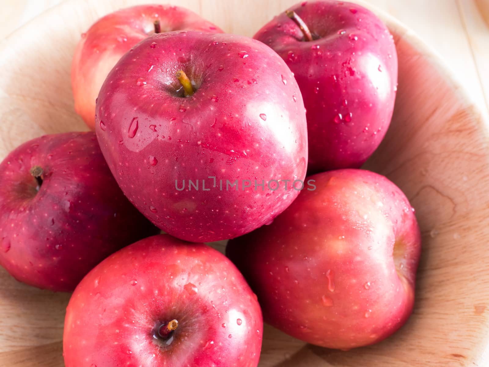 fresh red wet apples with water drops