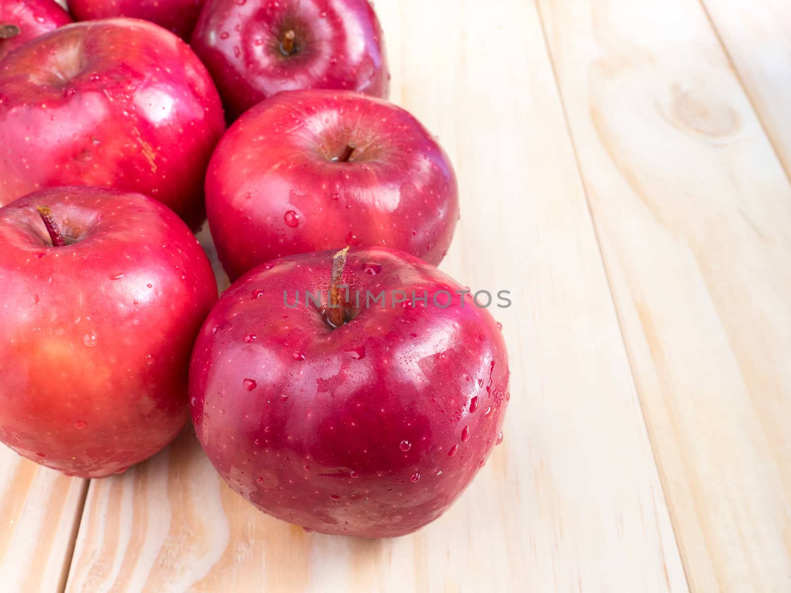fresh red wet apples with water drops