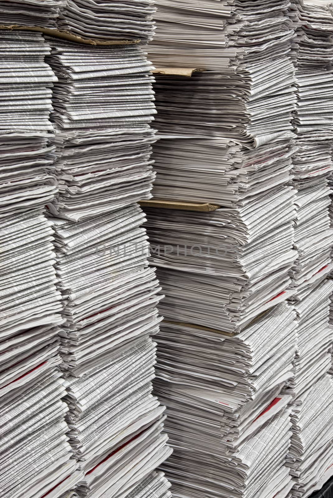 Vertical Stacks Of Newspapers At Warehouse by stockbuster1