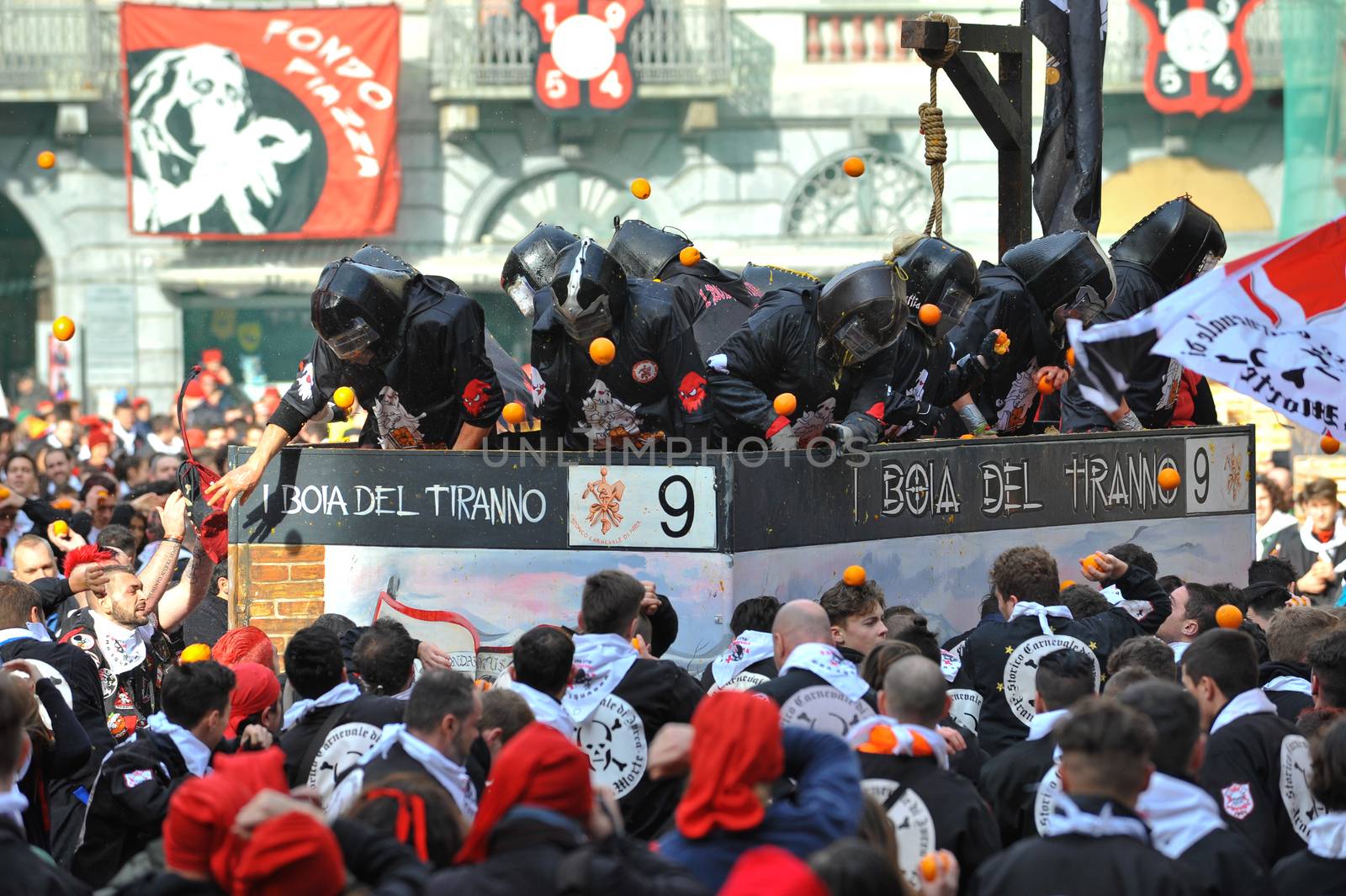 ITALY, Ivrea: People hit each other with oranges during the battle of oranges in Ivrea, Italy on February 8, 2016.This unique event sees people re-enact a middle age battle using oranges. Thousands gathered in the town to pelt each other with the fruit, which is imported from Sicily. 