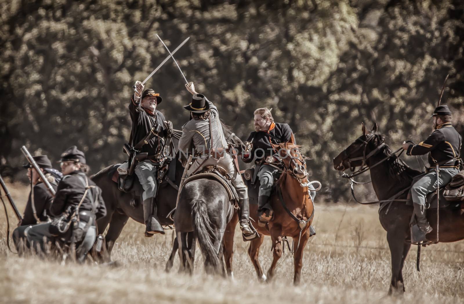 Northern Army scouts fight on horseback with the Confederates during Civil War Reenactment at Anderson, California.
Photo taken on: September 27th, 2014
