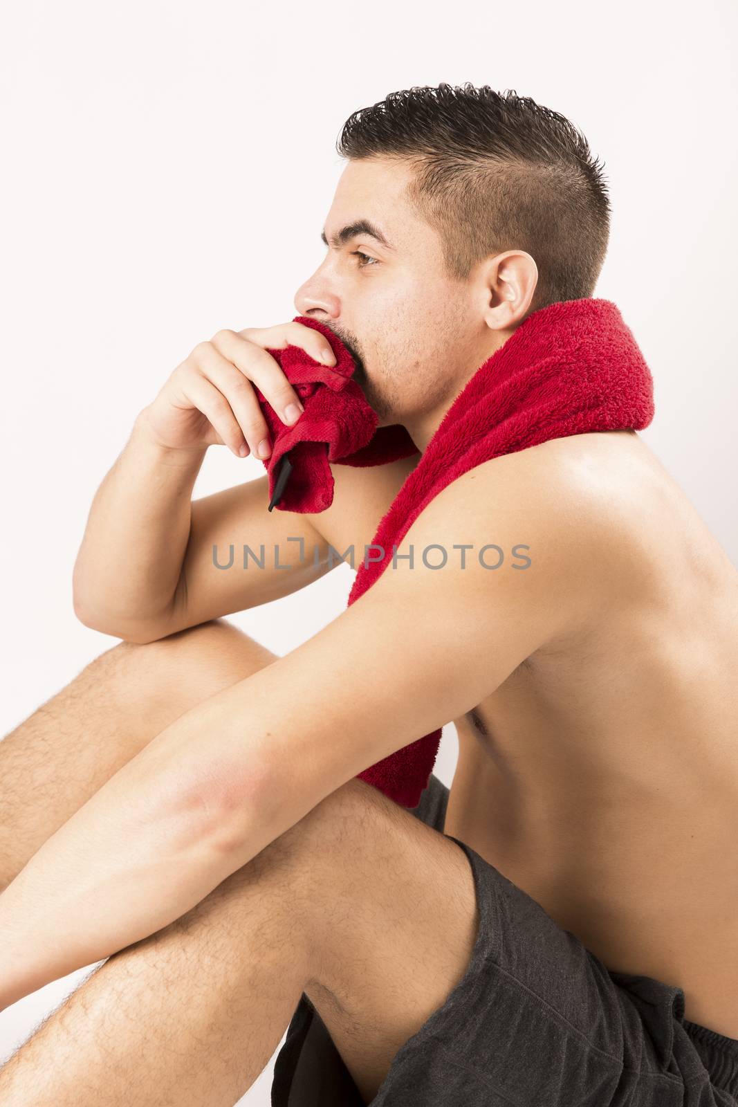 Muscle model man with red towel by CatherineL-Prod