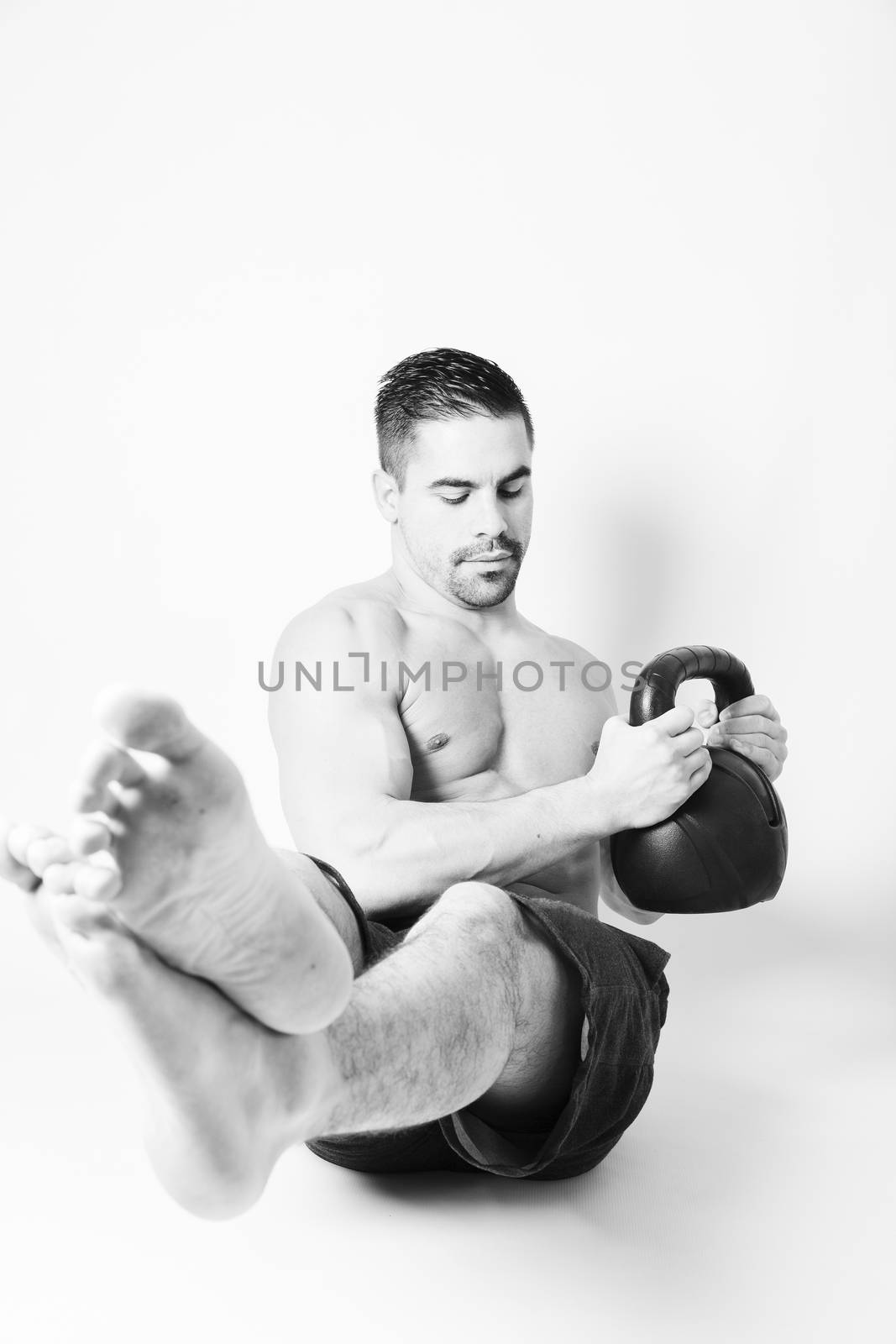 Strong beautiful man doing sport by CatherineL-Prod