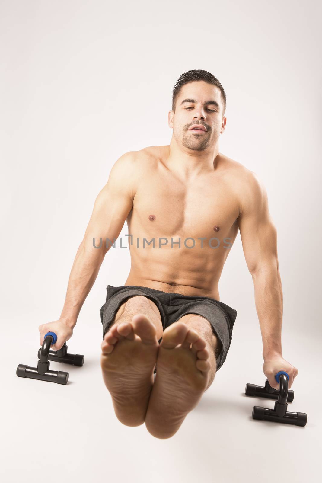 Strong model man doing push up exercises