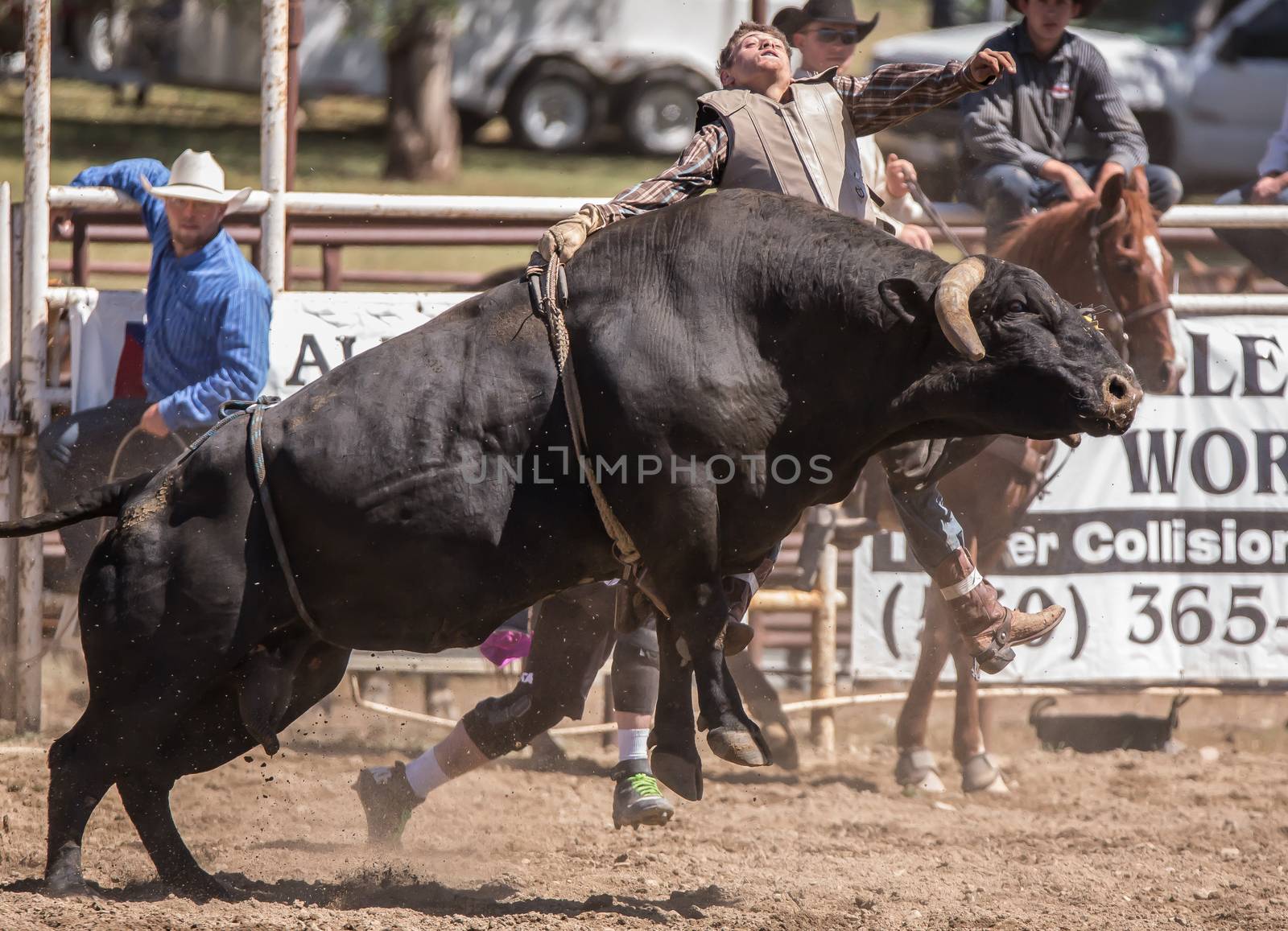 A bull rider in a rodeo competition. The rodeo in Cottonwood, California is a popular event on Mother's Day weekend in this small northern California town.
Photo taken on: May 10th, 2014