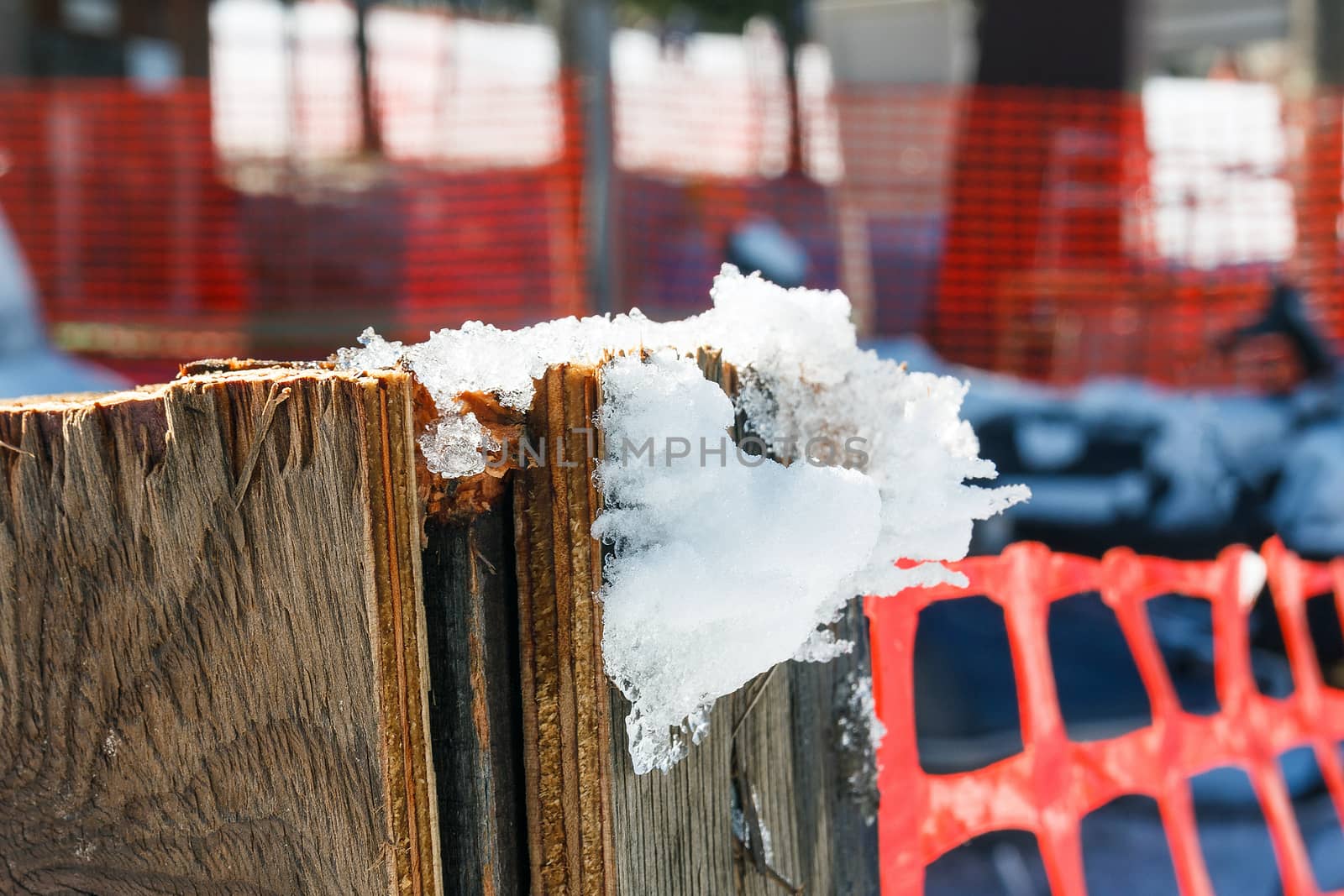 Snow hang on wood pole.